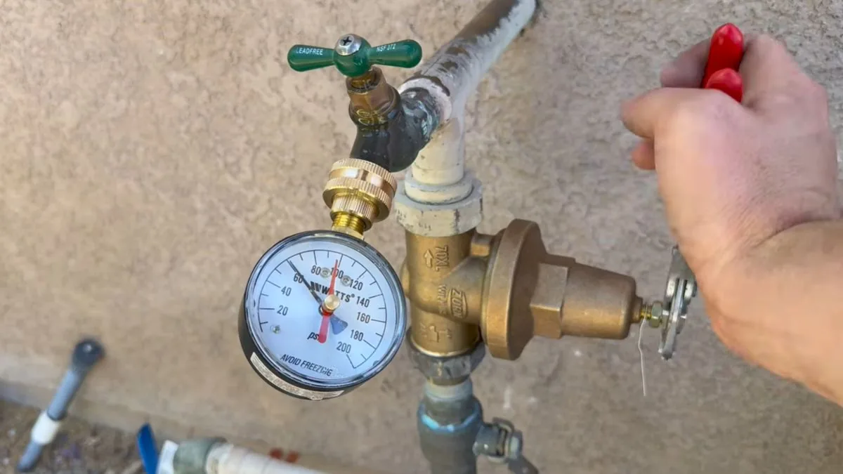 Pressure regulator with a gauge on a home water line, Burst Pipe Repair in Downey, CA