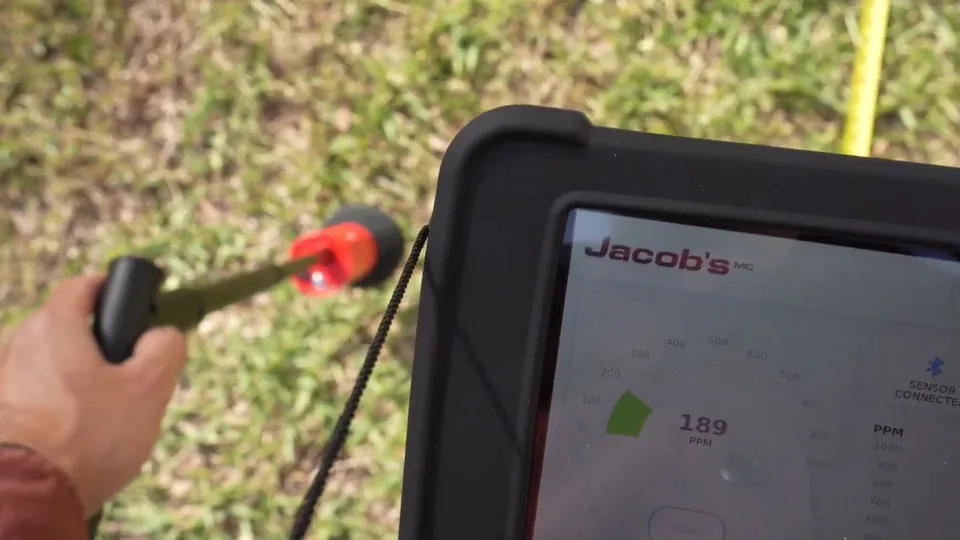 Handheld leak listening device and a tablet on a lawn, Slab Leak Detection in Downey, CA