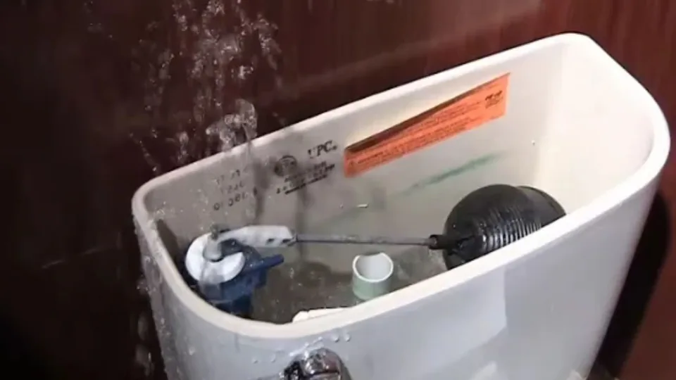 Toilet tank open showing the flapper and fill valve, Toilet Repair and Installation in Downey, CA
